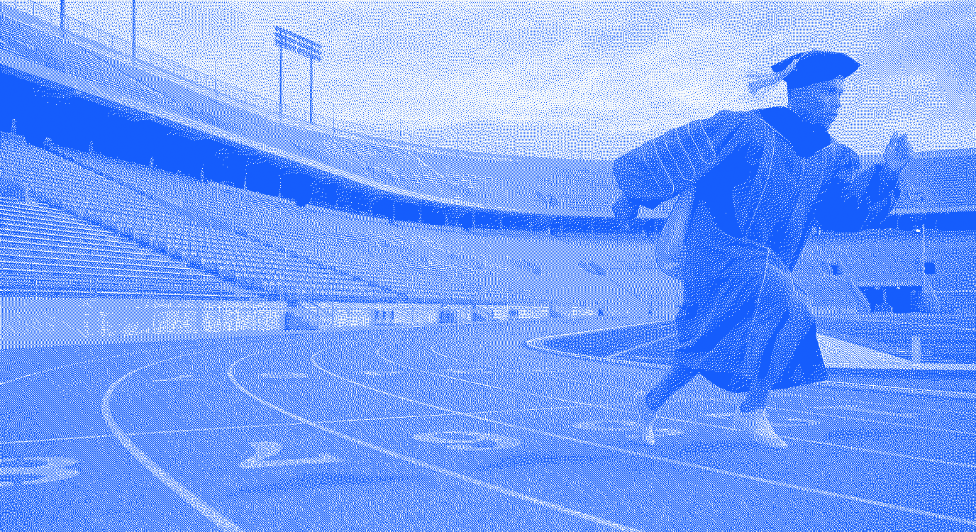 A runner training alone in a stadium